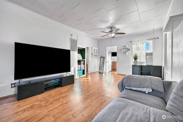 living room featuring ceiling fan and light wood-type flooring