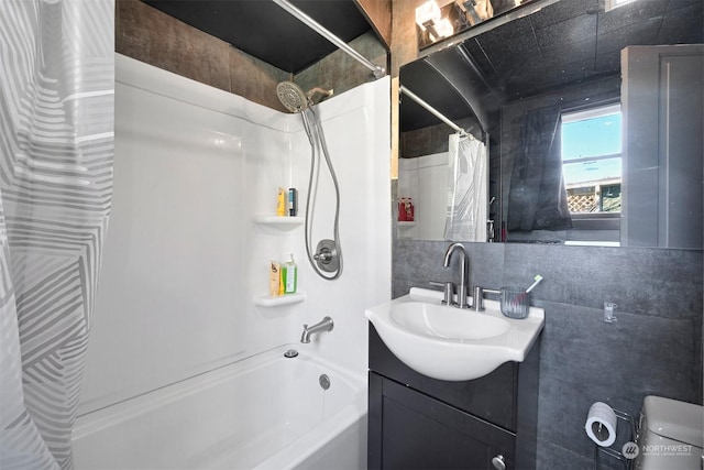 bathroom with shower / tub combo with curtain and vanity