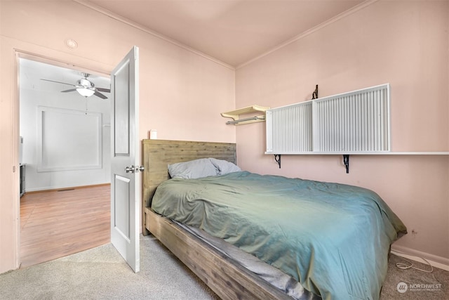 bedroom with light colored carpet and ornamental molding