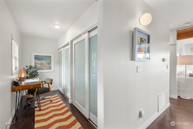 hallway featuring dark hardwood / wood-style floors