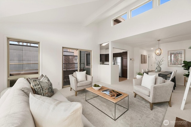 living area featuring light carpet, high vaulted ceiling, and beamed ceiling