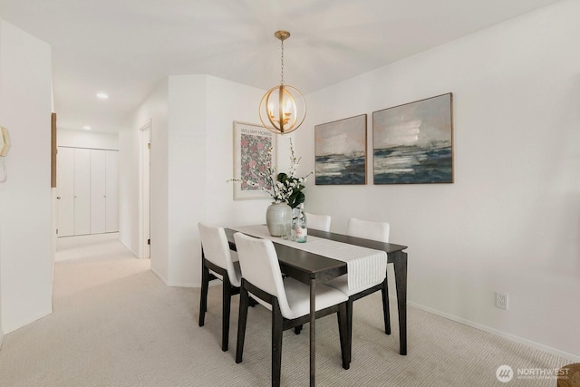 dining space with a notable chandelier, baseboards, carpet flooring, and recessed lighting