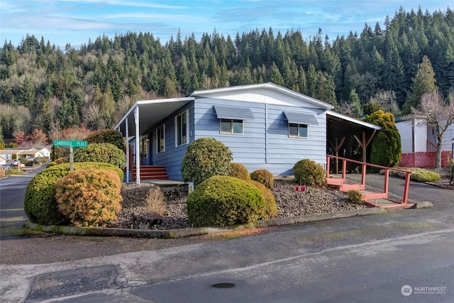 view of home's exterior with a carport