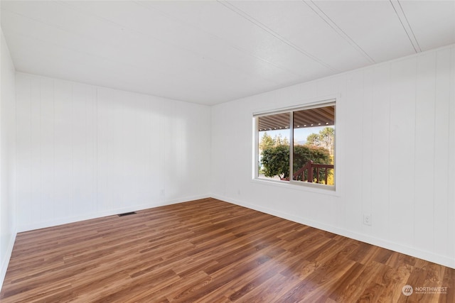 spare room featuring hardwood / wood-style flooring