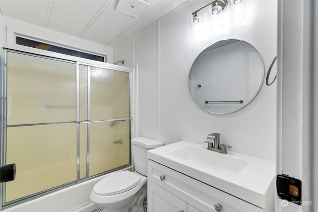 full bathroom with toilet, vanity, and shower / bath combination with glass door