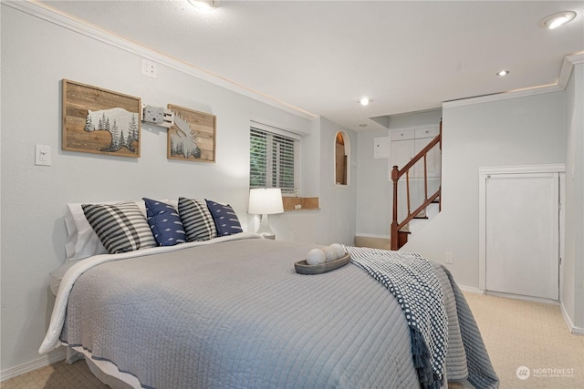 carpeted bedroom featuring ornamental molding