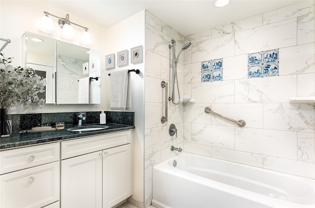 bathroom featuring vanity and tiled shower / bath combo