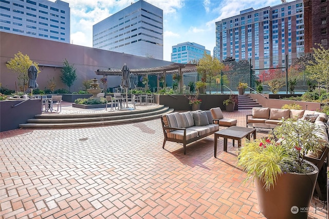 view of patio with an outdoor hangout area and a pergola