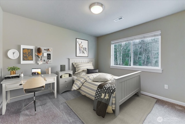 carpeted bedroom featuring visible vents and baseboards