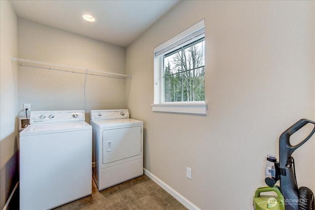 laundry area with wood finished floors, recessed lighting, separate washer and dryer, baseboards, and laundry area