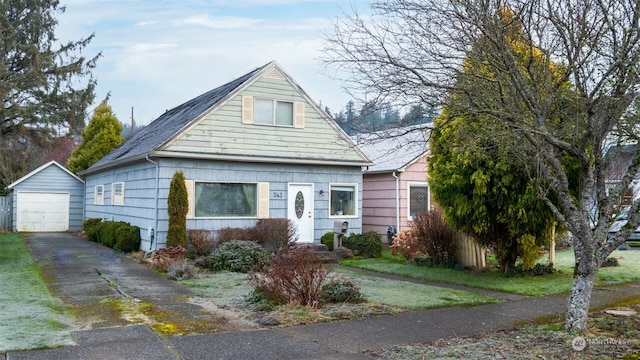 view of front of home featuring a garage and an outdoor structure