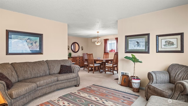 carpeted living room featuring a textured ceiling