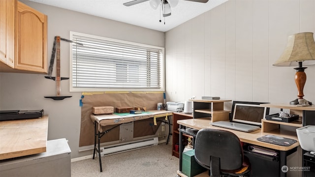 office featuring a baseboard heating unit, a textured ceiling, and ceiling fan