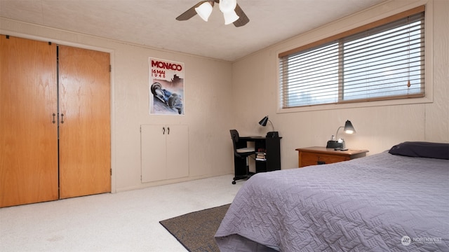 carpeted bedroom featuring ceiling fan