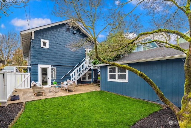 rear view of property featuring a patio and a yard