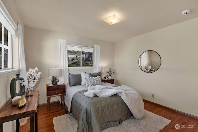 bedroom featuring dark wood-type flooring