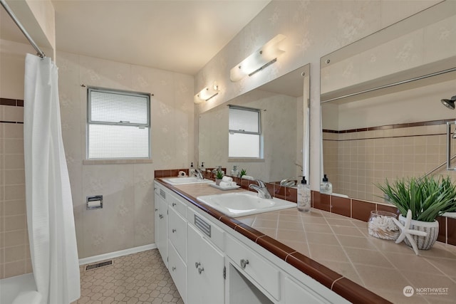 bathroom featuring vanity and walk in shower