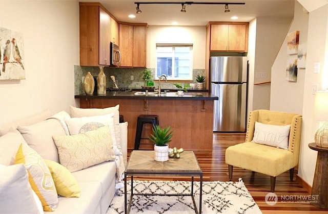 interior space with sink and light wood-type flooring