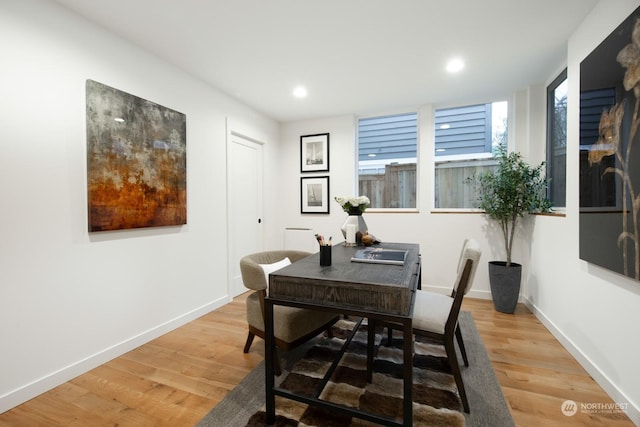 dining space with hardwood / wood-style floors