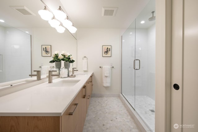 bathroom featuring vanity and an enclosed shower