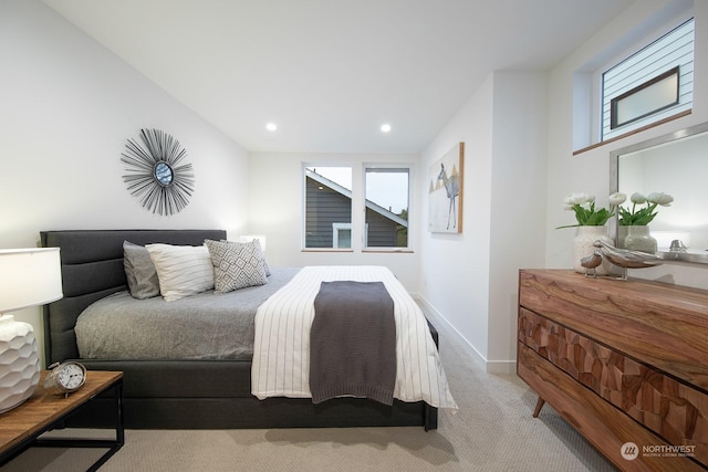 carpeted bedroom featuring multiple windows