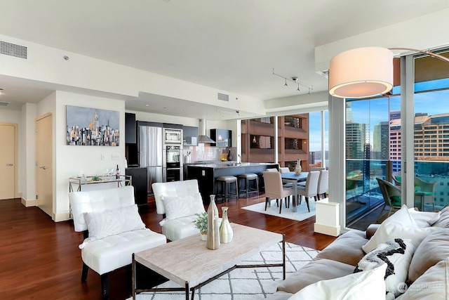 living room with dark hardwood / wood-style flooring