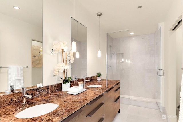 bathroom with vanity and a shower with shower door