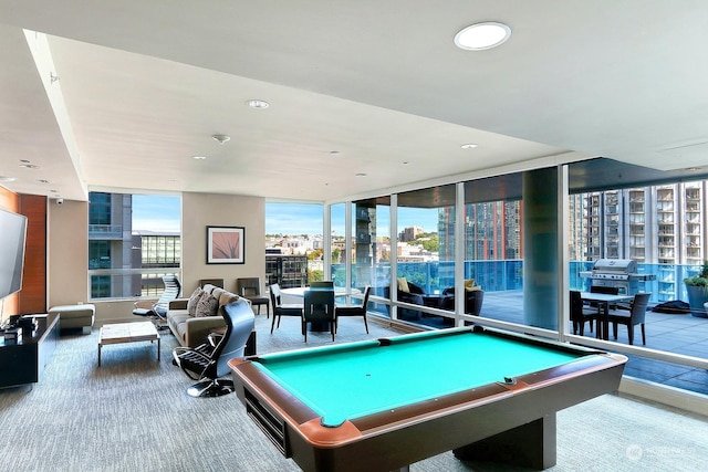 game room featuring pool table, a wall of windows, and carpet