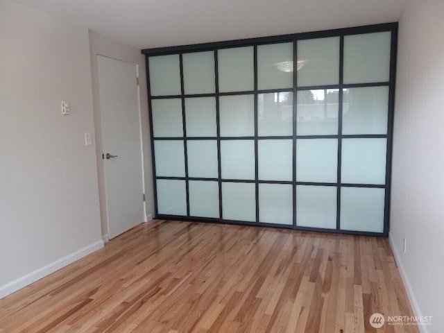 spare room with light hardwood / wood-style flooring