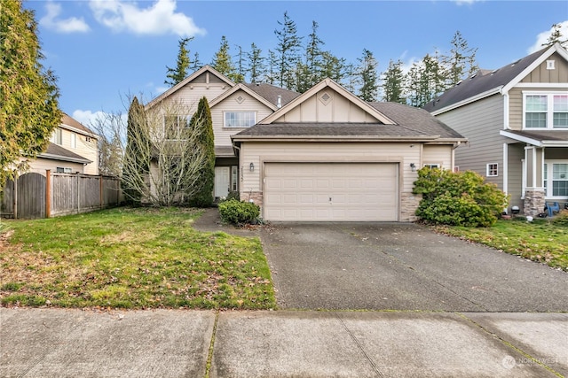 view of front of home featuring a garage and a front yard