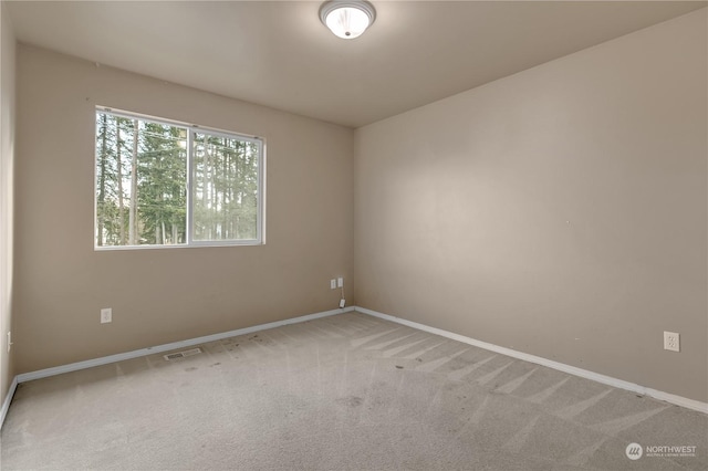 spare room featuring carpet flooring