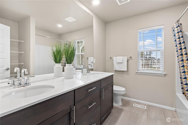 full bathroom featuring vanity, toilet, and shower / bath combo