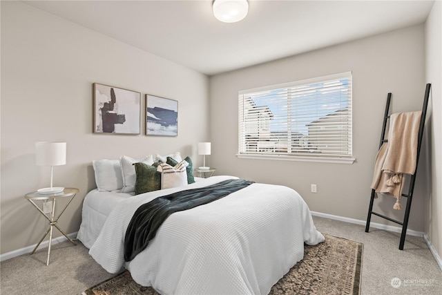 bedroom featuring light carpet