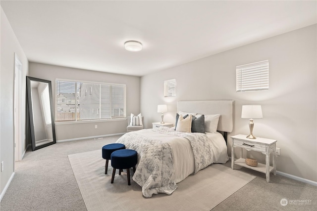 bedroom featuring light carpet