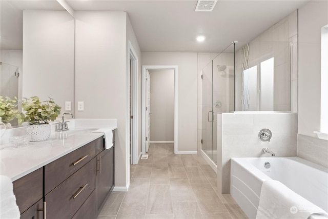 bathroom with vanity, shower with separate bathtub, and tile patterned floors