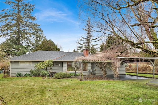 ranch-style house featuring a carport and a front yard