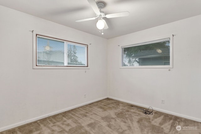 carpeted empty room with ceiling fan