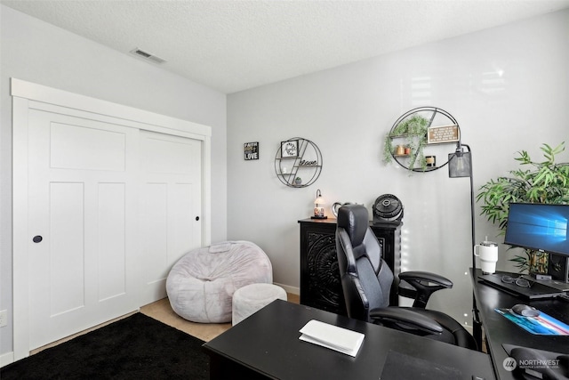 home office with a textured ceiling