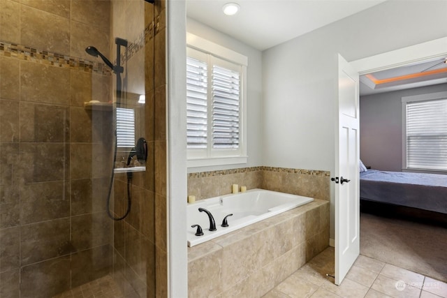 bathroom featuring separate shower and tub and tile patterned flooring