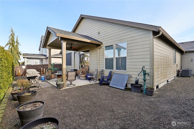 back of house featuring ceiling fan, a patio, and central air condition unit