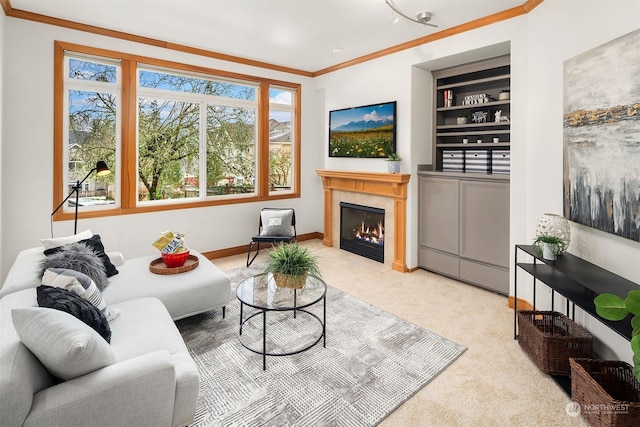 living room featuring a tiled fireplace, carpet floors, built in features, and ornamental molding