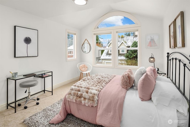 bedroom with vaulted ceiling and light carpet