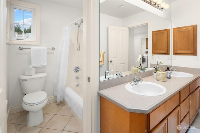 full bathroom featuring washer / clothes dryer, tile patterned flooring, vanity, toilet, and shower / bath combo