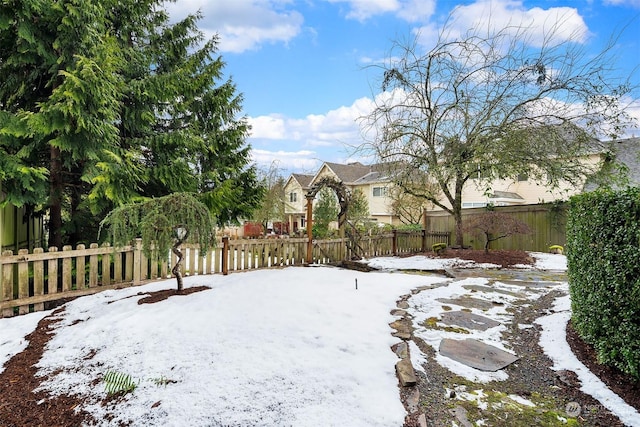 view of yard layered in snow