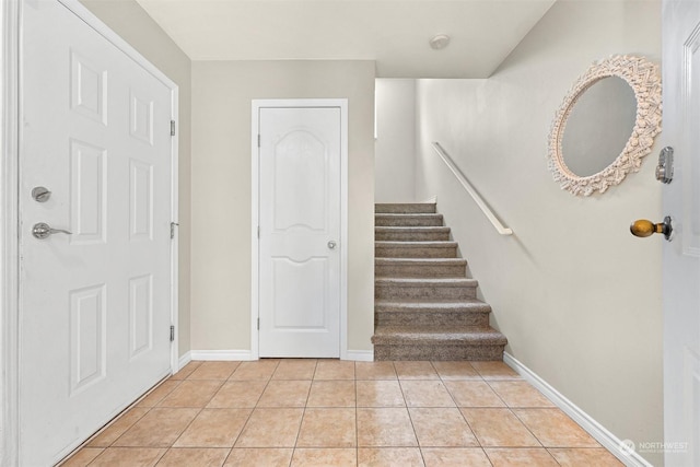 staircase featuring tile patterned floors