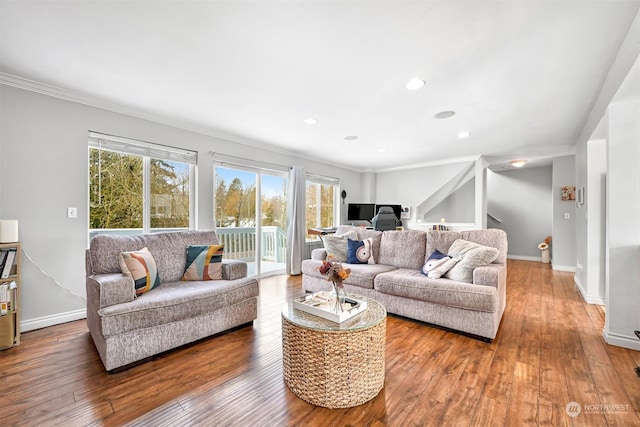 living room with hardwood / wood-style floors and ornamental molding