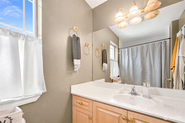 bathroom with vanity and walk in shower