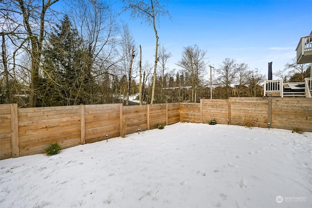 view of yard covered in snow