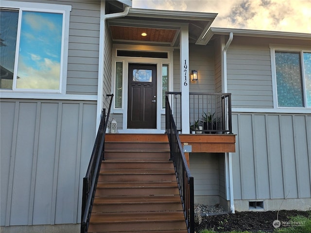 view of exterior entry at dusk