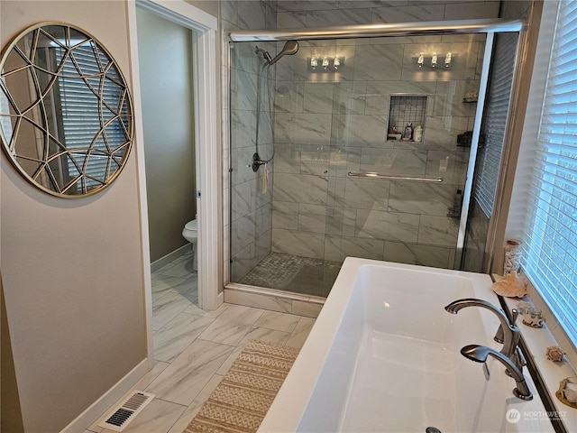 bathroom featuring shower with separate bathtub and toilet